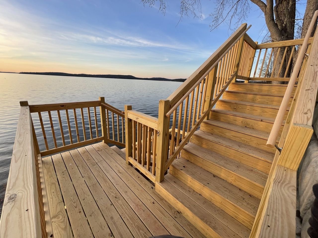 Cedar stairs and landing running down to the shoreline at sunset