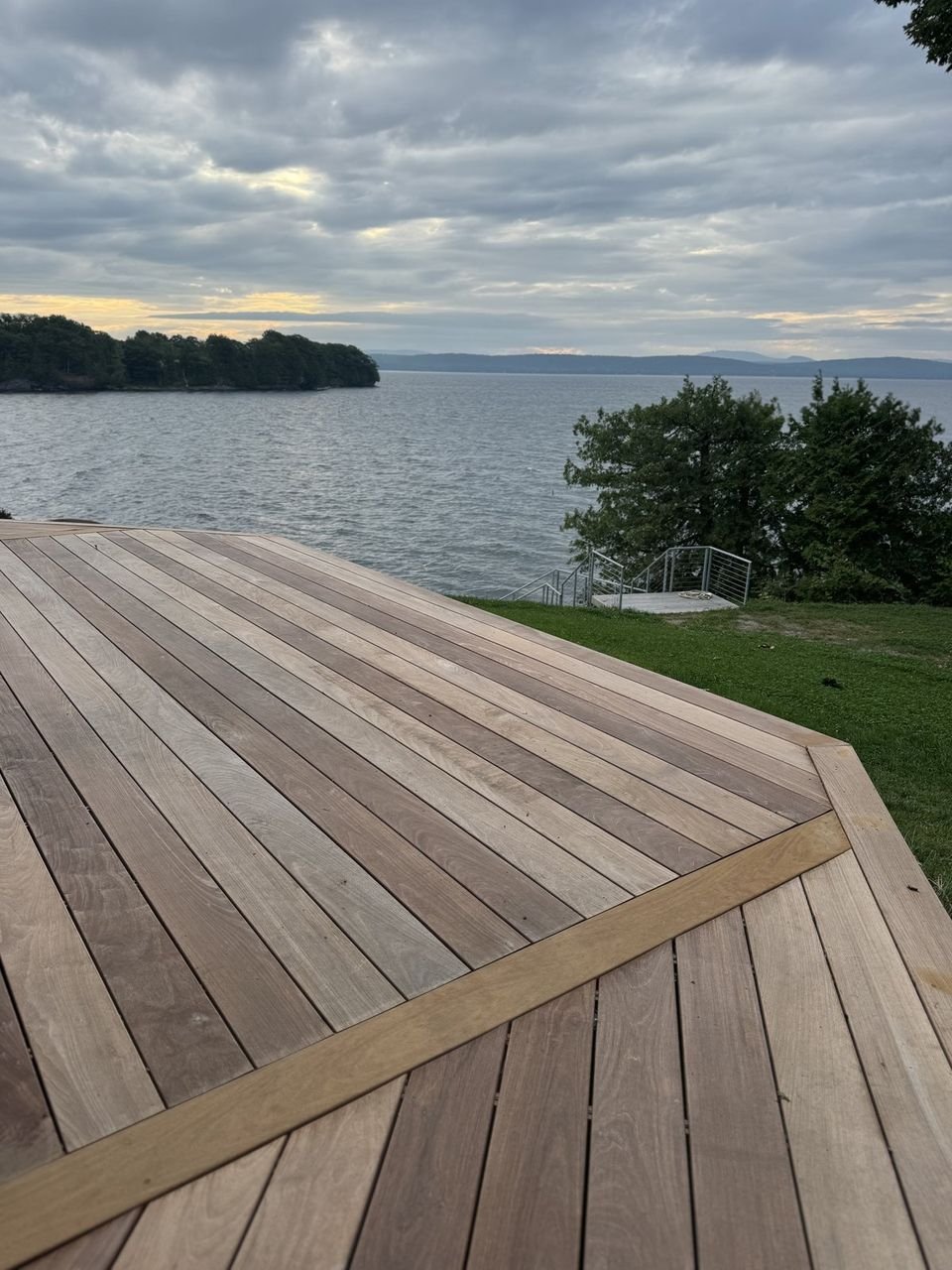 Hardwood deck laid on a diagonal overlooking the lake